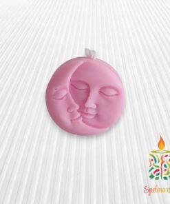 Vela con silueta de sol y luna rosa