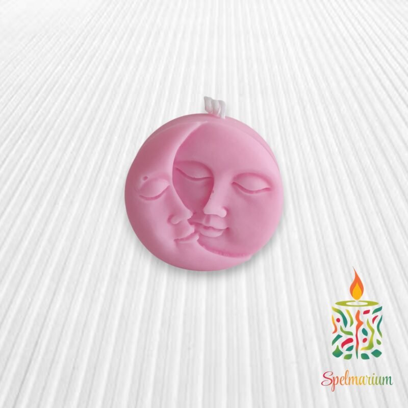 Vela con silueta de sol y luna rosa